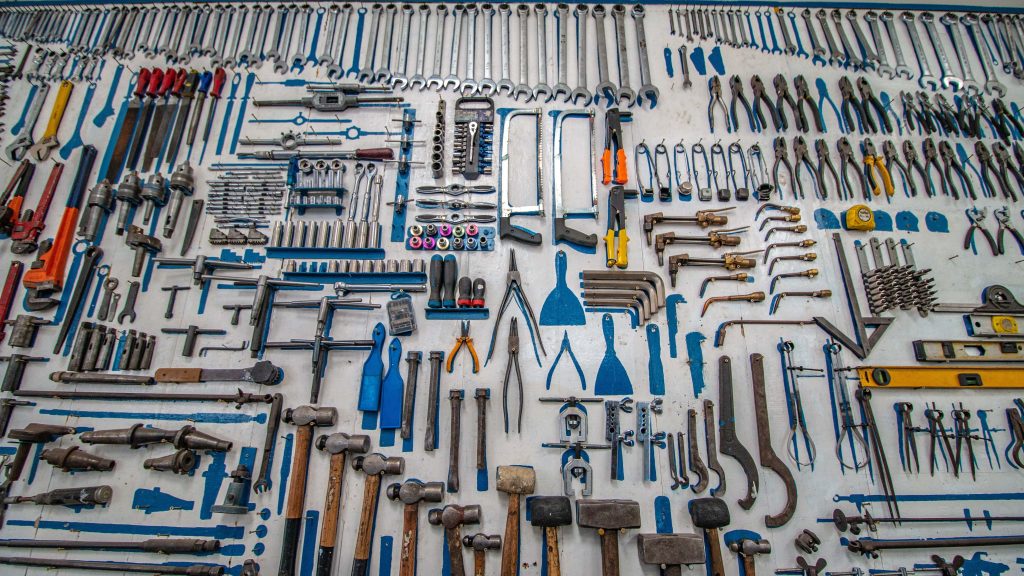 a huge variety of tools on a wall