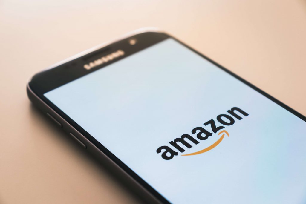 A smartphone with the Amazon app loading
