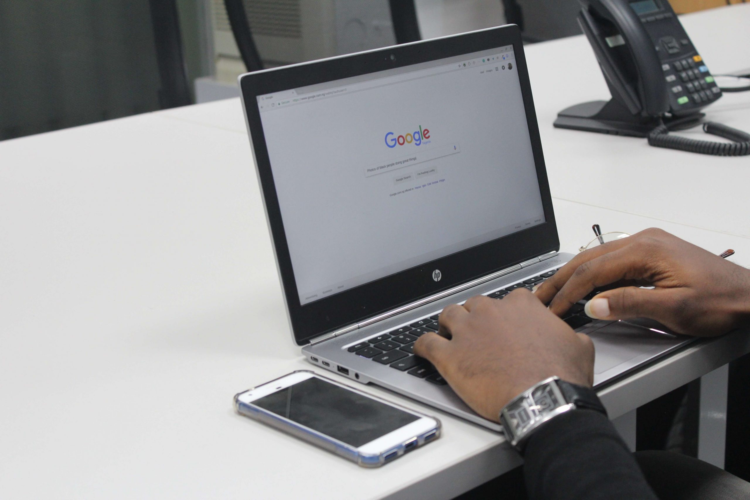 Someone typing something into Google