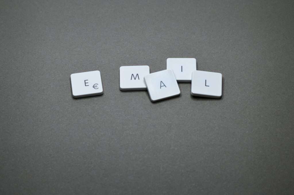 Scrabble-style blocks that spell out EMAIL with one letter on each tile