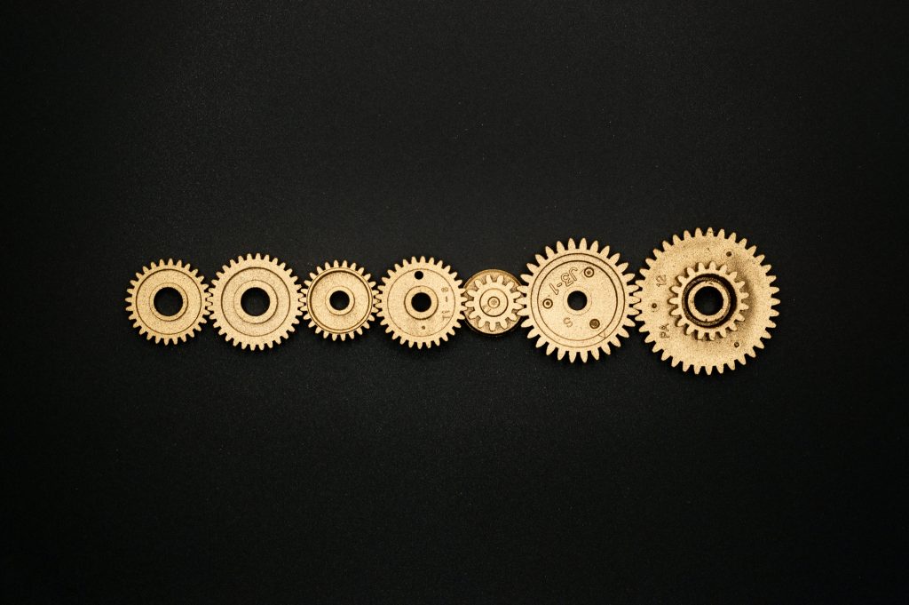 wheels gears that are connected one by one to signify the website content migration process