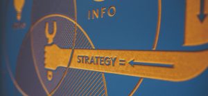 Embossed image of circles and a blue arrow pointing to the words strategy